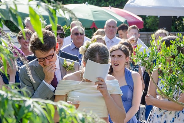 Bride and groom embarrassed during wedding speeches